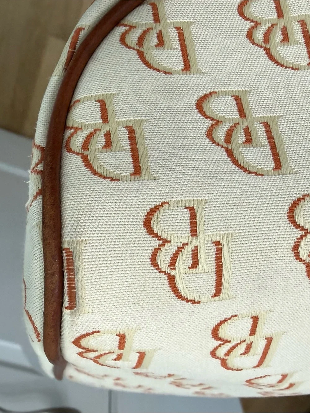 Dooney & Bourke Cream/Brown Signature Logo Lock Canvas Hobo Shoulder Bag